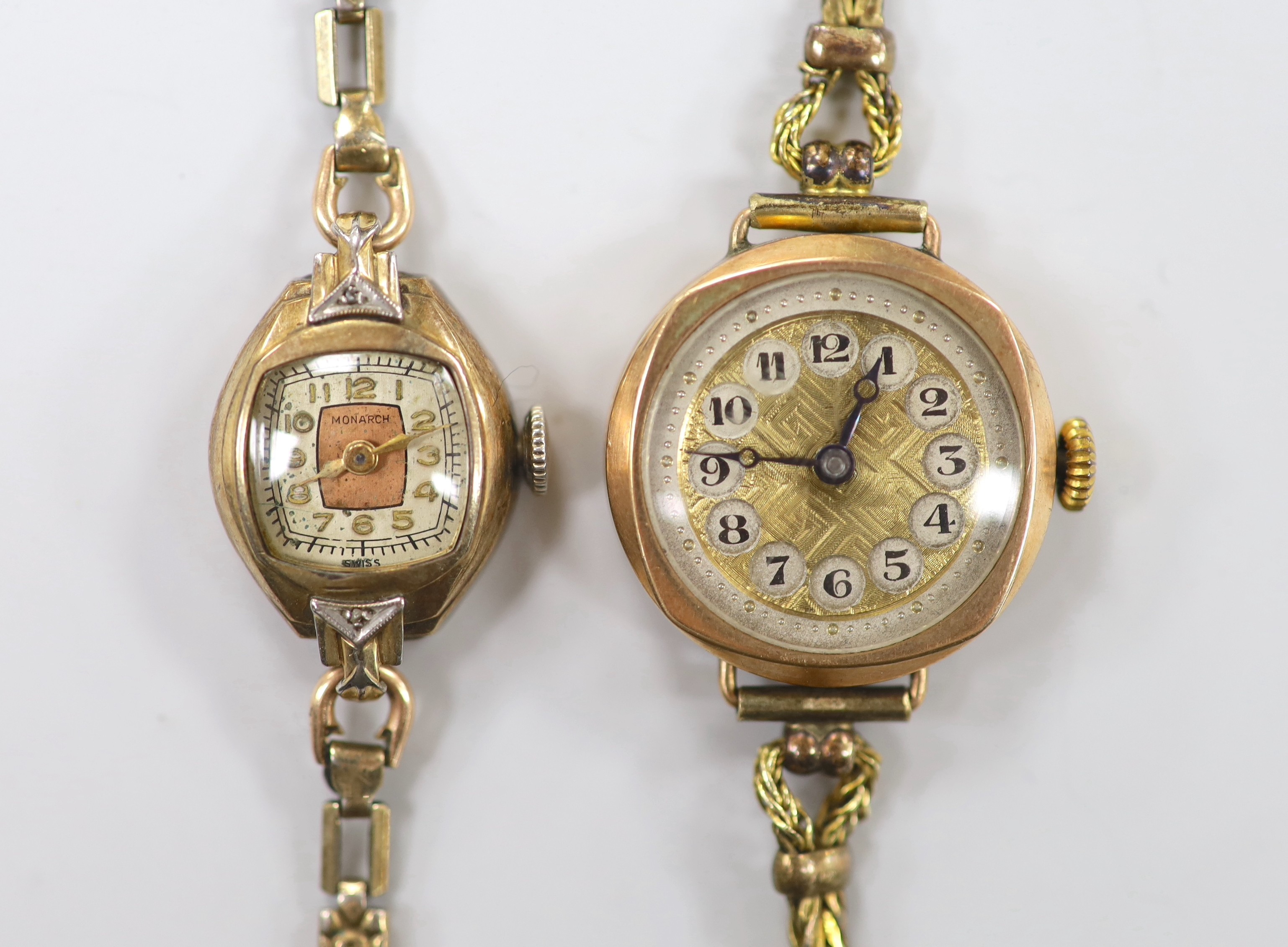 A lady's early 20th century 9ct gold manual wind wrist watch, on a gold plated bracelet and a lady's 10k gold filled Monarch manual wind wrist watch, on gold plated bracelet.